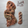 The Desperado Club - Hand dyed variegated yarn, Fingering Weight, inspired by Dungeon Crawler Carl book series - warm brown with hints of green