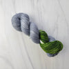 Folklore - Hand dyed sock yarn - grey and moss green speckled assigned color pooling yarn Taylor Swift inspired
