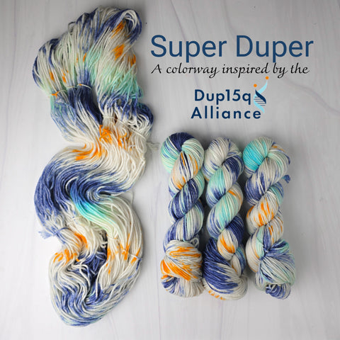 Super Duper - Hand dyed yarn, white with splashes of navy turquoise and orange dup15q alliance colors