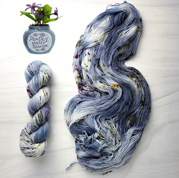 Deadly Nightshade - Hand dyed yarn - Nightmare Before Christmas inspired collection - blue grey with speckles purple green moss