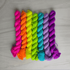 Neon Rainbow mini yarn set of 7 solid colored mini skeins - Hand dyed 20g each glows in blacklight