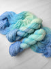 Stay Frosty - Hand dyed Variegated yarn, Fingering Weight, inspired by Dungeon Crawler Carl book series - sky blue and light ice blue Elle McGibbons