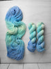 Stay Frosty - Hand dyed Variegated yarn, Fingering Weight, inspired by Dungeon Crawler Carl book series - sky blue and light ice blue Elle McGibbons