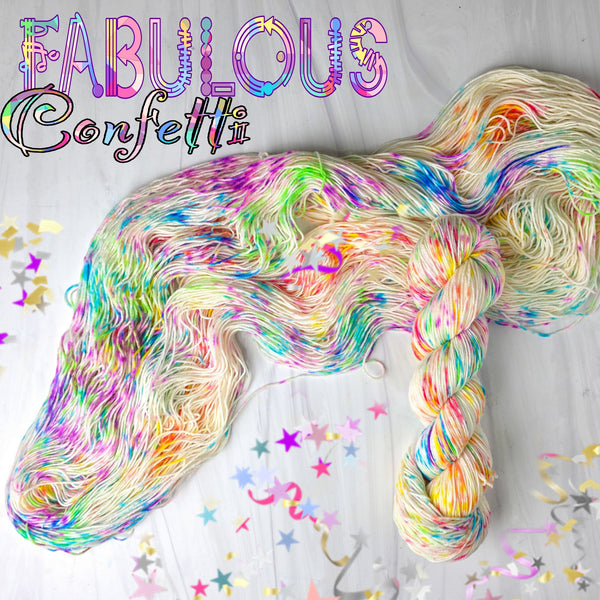 Fabulous Confetti - Hand dyed yarn, white with splashes of rainbow of fuchsia magenta yellow blue purple orange