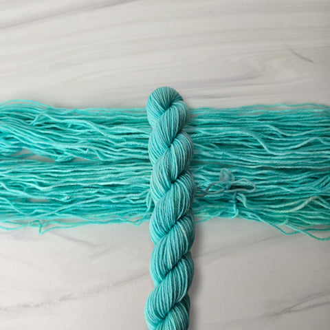 Neon Blue - Tonal solid - Hand dyed yarn - glows under blacklight UV reactive - choose your base fingering sport DK worsted Aran bulky dyed to order florescent light blue aqua