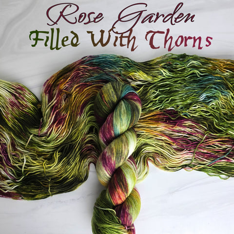 Rose Garden Filled With Thorns - Hand dyed variegated yarn - moss green forest lichen with burgundy maroon pops