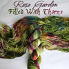 Rose Garden Filled With Thorns - Hand dyed variegated yarn - moss green forest lichen with burgundy maroon pops