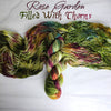 Rose Garden Filled With Thorns - Hand dyed variegated yarn - moss green forest lichen with burgundy maroon pops