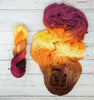 Chase the Light - Hand dyed variegated yarn - yellow orange brown maroon palindrome