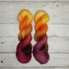 Chase the Light - Hand dyed variegated yarn - yellow orange brown maroon palindrome