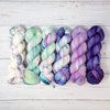 Frozen Flowers - Hand dyed variegated yarn - Merino Fingering to worsted white with purple lilac violet lavender green speckles