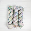Pieces of April - Hand dyed sock yarn - pastel sage grey with speckles of pink blue green toffee
