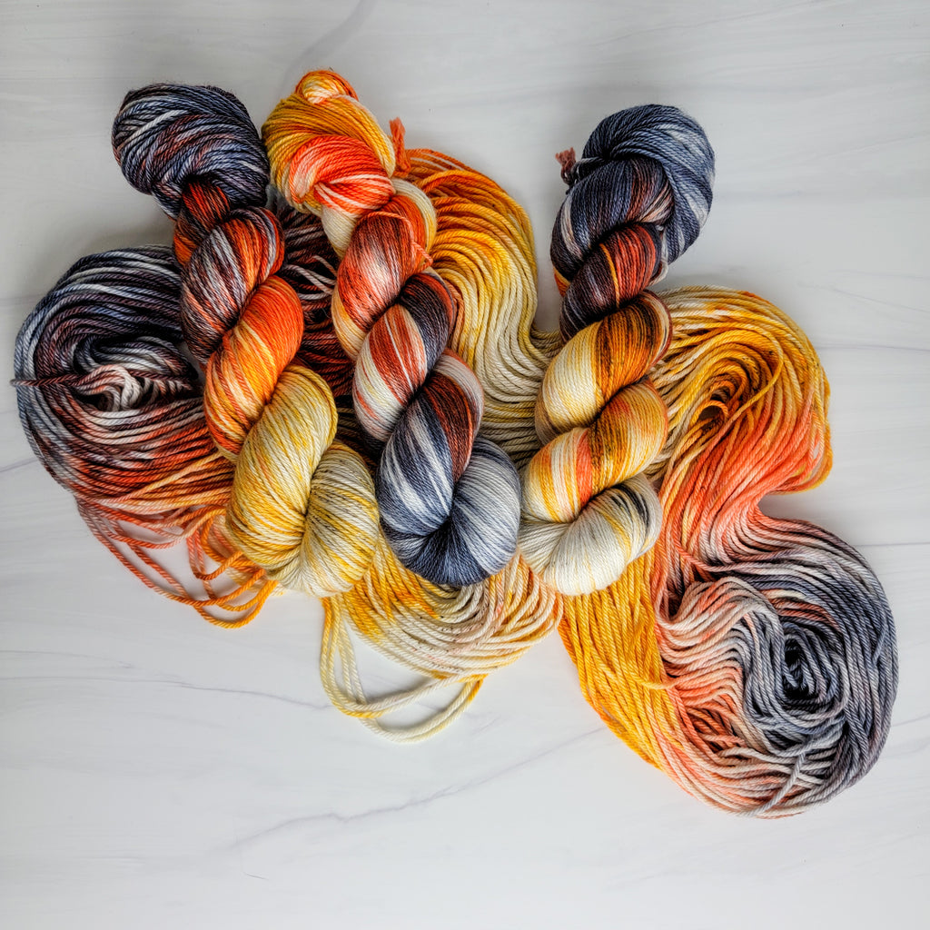 Dead Man's Hand - Hand dyed variegated yarn - grey orange tan speckles