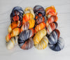 Dead Man's Hand -  Hand dyed variegated yarn - grey orange tan speckles