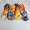 Dead Man's Hand -  Hand dyed variegated yarn - grey orange tan speckles