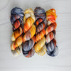 Dead Man's Hand -  Hand dyed variegated yarn - grey orange tan speckles