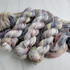 Pebbles in the Sand-  Hand dyed variegated yarn - grey with speckles of brown blue red green