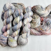 Pebbles in the Sand-  Hand dyed variegated yarn - grey with speckles of brown blue red green