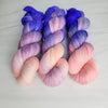 Living Mirage -  Hand dyed variegated yarn - peach pink purple blue violet