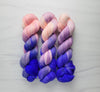 Living Mirage -  Hand dyed variegated yarn - peach pink purple blue violet