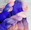 Living Mirage -  Hand dyed variegated yarn - peach pink purple blue violet