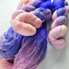 Living Mirage -  Hand dyed variegated yarn - peach pink purple blue violet