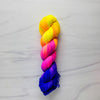 Neon Sunset - Hand dyed yarn, Fingering Weight, florescent fuchsia yellow violet purple glows in black light