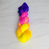Neon Sunset - Hand dyed yarn, Fingering Weight, florescent fuchsia yellow violet purple glows in black light