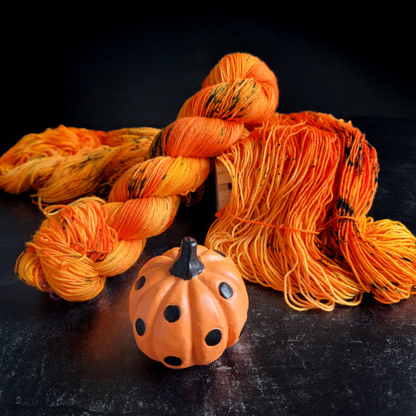 Pumpkin Head - Hand dyed yarn, Fingering Weight, Halloween yarn - orange with green and black speckles