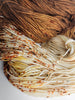 Praline - Hand dyed assigned color pooling yarn - SW Merino Fingering Weight warm brown and cream with speckles