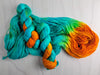 Copper Patina - Hand dyed assigned pooling yarn - turquoise with bright orange pop
