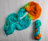 Copper Patina - Hand dyed assigned pooling yarn - turquoise with bright orange pop
