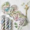 Pieces of April - Hand dyed sock yarn - pastel sage grey with speckles of pink blue green toffee