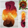 Chase the Light - Hand dyed variegated yarn - yellow orange brown maroon palindrome