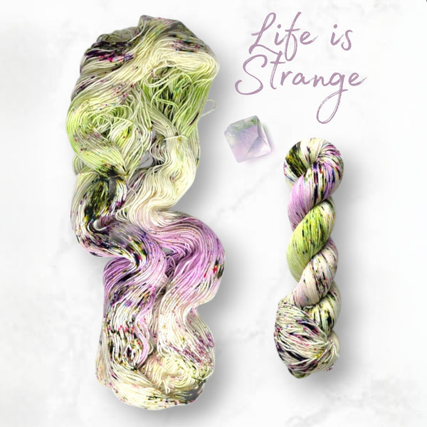 Life is Strange - Hand dyed variegated yarn - Indie Song Tracks collection - Merino Fingering to worsted dyed to order - white with pastel purple pink moss green speckles