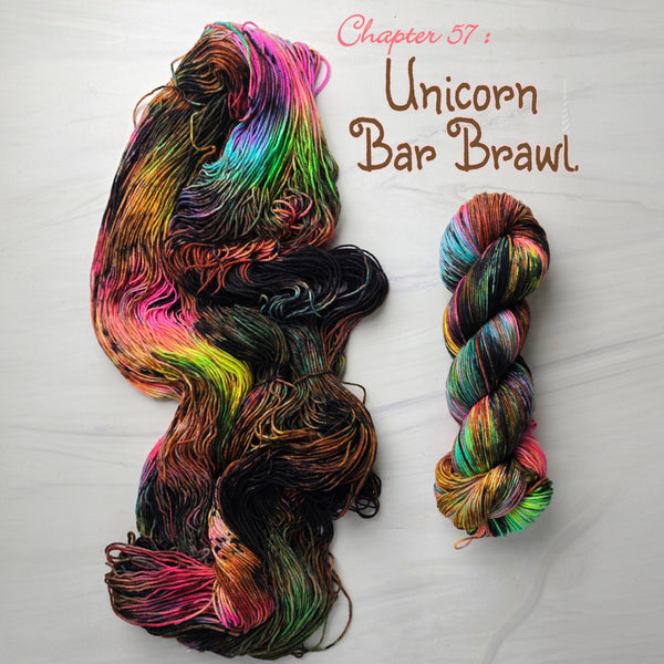 Unicorn Bar Brawl chapter 57 - Hand dyed variegated  yarn, Fingering Weight, inspired by Dungeon Crawler Carl book series - neon pink yellow blue with brown splashed