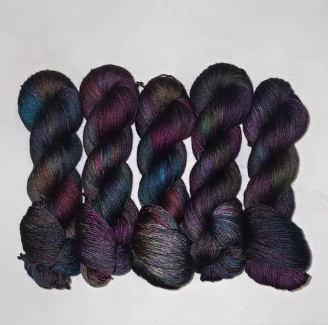 Ready to ship - Black Magic on SW Merino silk fingering weight yarn - Priced per skein - black rainbow oil slick colors