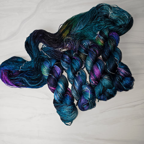 Ready to ship - Abraxos on pure silk fingering weight yarn - Priced per skein - blue purple black oil slick colors