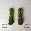 Lichen Creek - Hand dyed assigned pooling yarn - moss green with burgundy maroon and teal forest pop