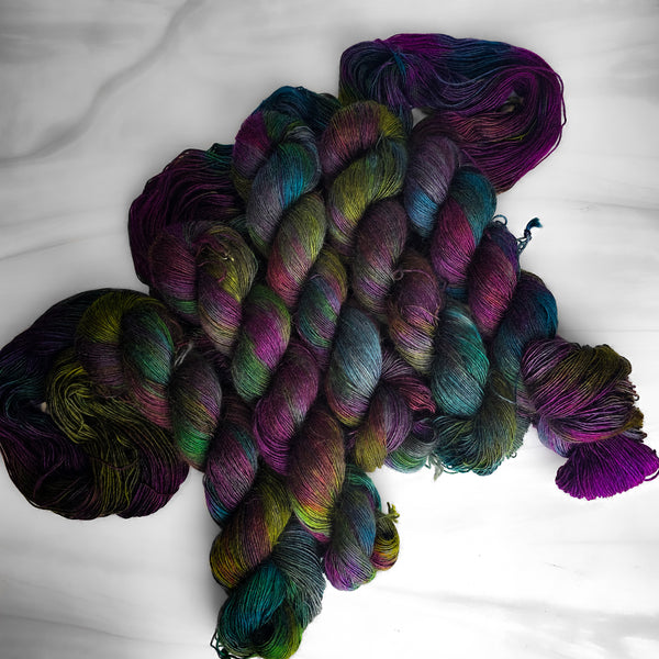 Ready to ship - Black Magic on kid mohair singles fingering weight yarn - Priced per skein - black rainbow oil slick colors