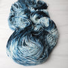 Shadowsinger - Hand dyed yarn, Fingering Weight, speckled assigned pooling inspired by ACOTAR by Sarah J Maas - white with speckles and dark navy teal blue azriel