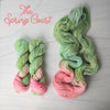 The Spring Court - Hand dyed assigned pooling yarn, Fingering Weight, speckled inspired by ACOTAR by Sarah J Maas - Pastel greens with a peachy pink pop and green speckles