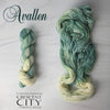 Avallen - Hand dyed Assigned Pooling yarn, Fingering Weight, speckled tonal inspired by the Crescent City series by Sarah J Maas - light puddy green  with a pastel green white speckled color pop