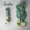 Avallen - Hand dyed Assigned Pooling yarn, Fingering Weight, speckled inspired by the Crescent City series by Sarah J Maas - light puddy green  with a pastel green white speckled color pop