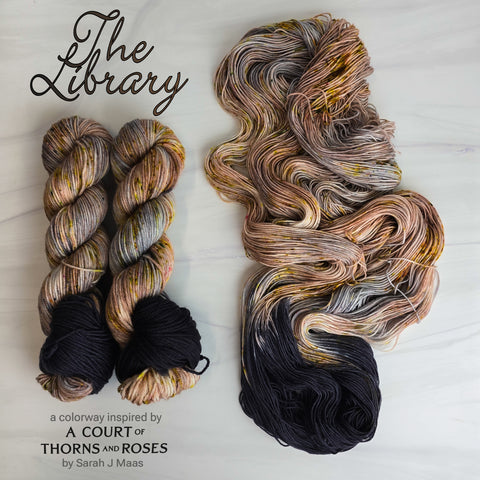 The Library  - Hand dyed yarn, Fingering Weight, speckled assigned pooling inspired by ACOTAR by Sarah J Maas - grey brown with speckles and a black pop