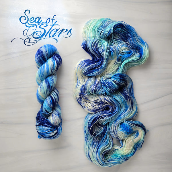 Sea of Stars - Hand dyed yarn, Fingering dk worsted Aran bulky Weight, speckled - white with midnight blue turquoise indigo