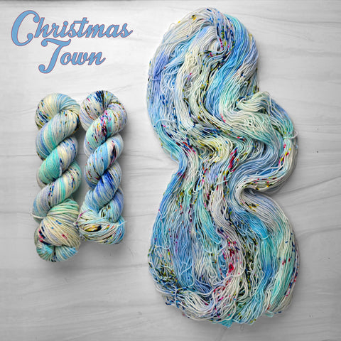 Christmas Town - Hand dyed yarn - Nightmare Before Christmas inspired collection - blue white with speckles of red green peach rainbow