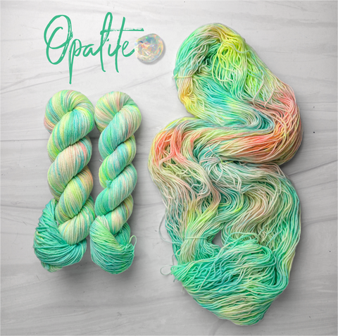 Opalite - Hand dyed, neon pastel green blue yellow with hints of peach  -  Taylor Swift inspired yarn glows under blacklight