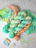 Opalite - Hand dyed, neon pastel green blue yellow with hints of peach  -  Taylor Swift inspired yarn glows under blacklight