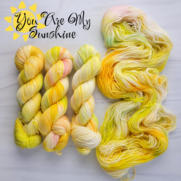You Are My Sunshine - Hand dyed variegated yarn -pastel yellow with rainbow pops - lullabies and nursery rhymes collection